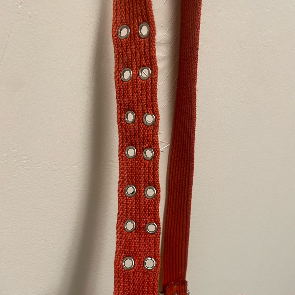 Orange canvas double studded eyelet belt.